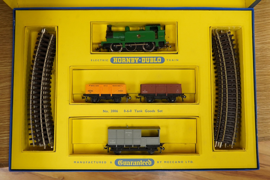 A collection of Hornby Dublo for 2 rail running, including; a boxed BR class A4 4-6-2, Golden Fleece 60030, (2211), together with three boxed bogie coaches and two wagons, plus four unboxed wagons, and a complete box set